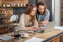 Couple doing something on the laptop