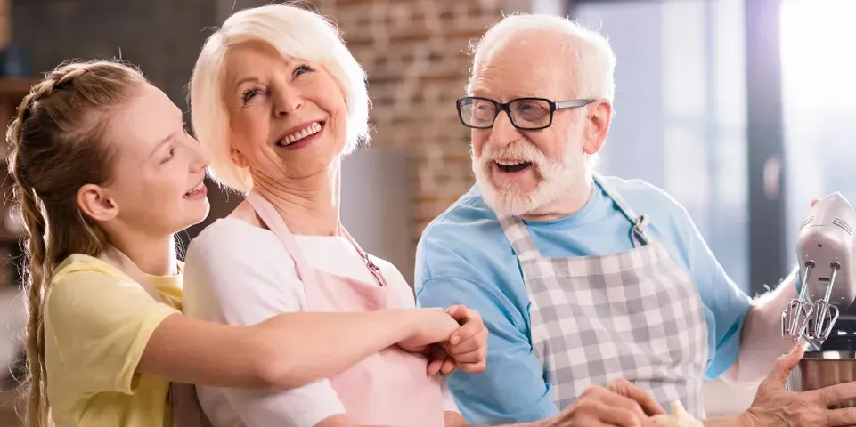 Old couple enjoying the company of their grandaughter