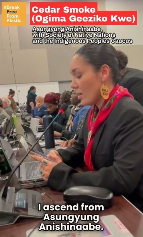 Woman speaking at a table,