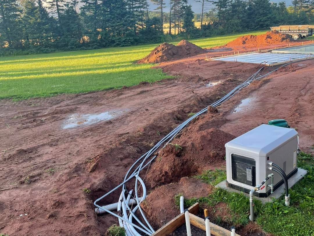 A generator is sitting in the middle of a dirt field.