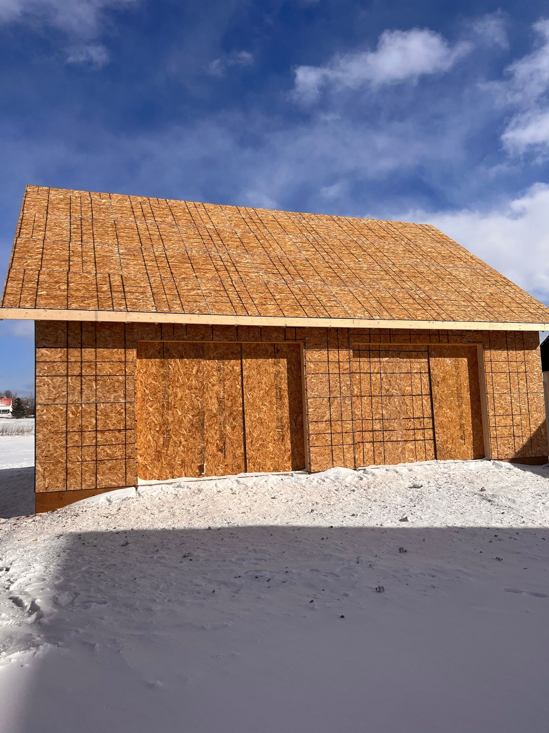 A wooden building with a blue sky in the background