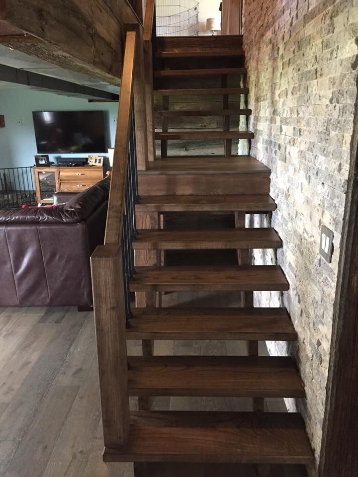 A wooden staircase leading up to the second floor of a house.