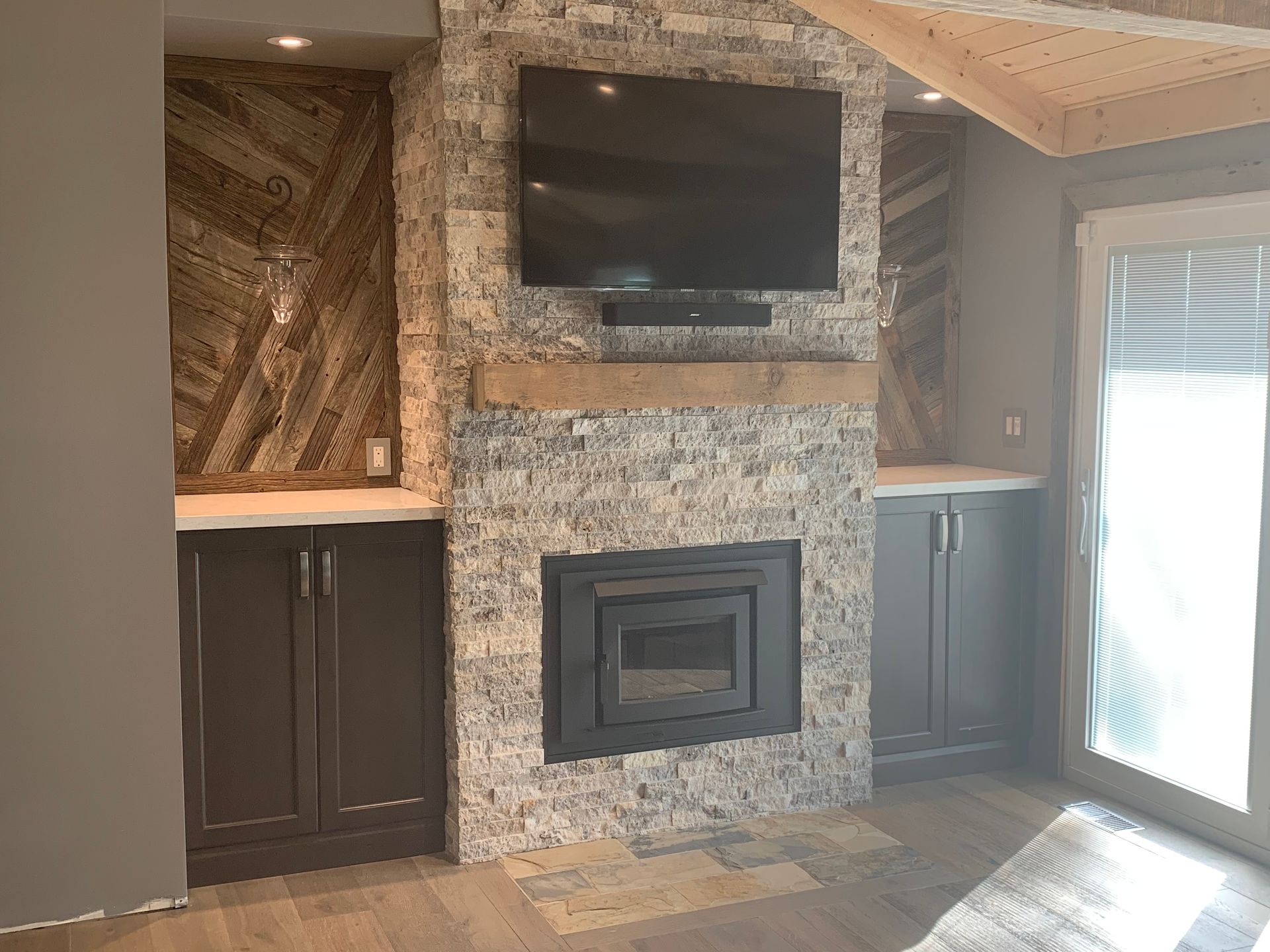 A living room with a fireplace and a flat screen tv.