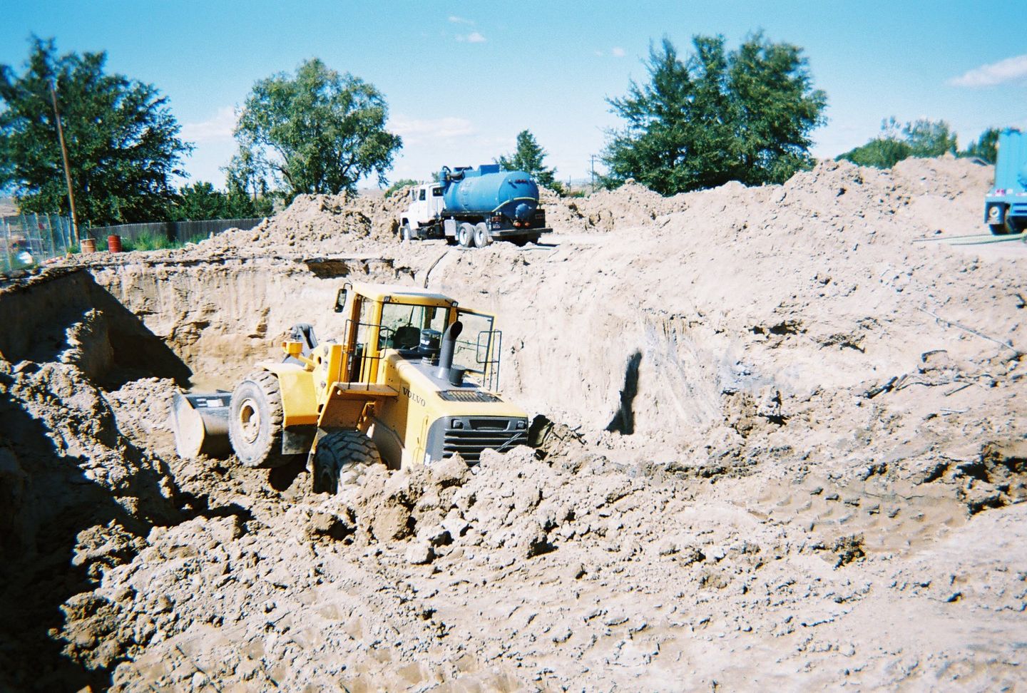 Bulldozer Excavating Dirt - Equipment Hauling Services in Pueblo,CO and the Surrounding Area