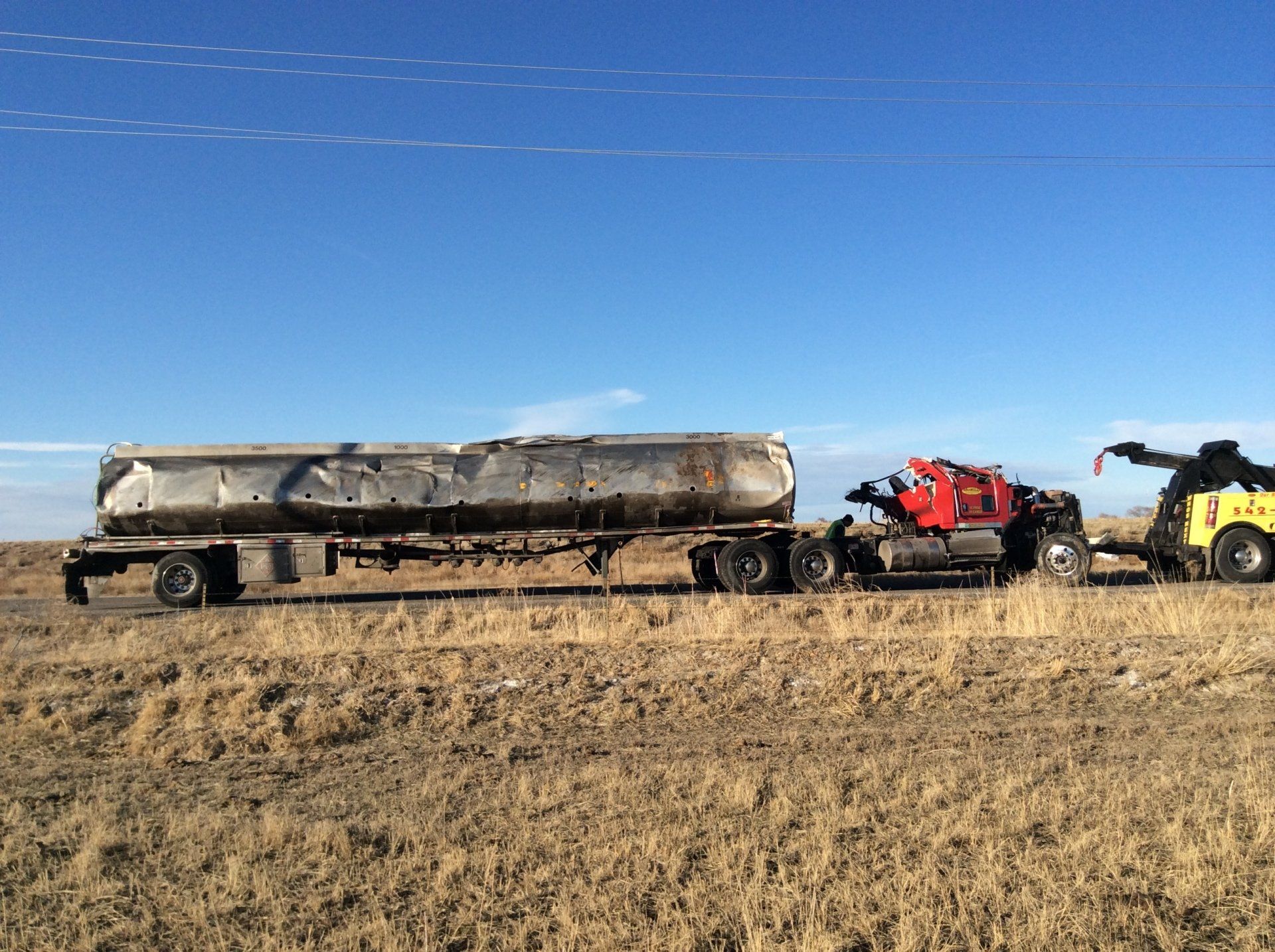 Tow Truck Pulling Semi With Tanker - Tow Truck Services in Pueblo,CO and the Surrounding Area