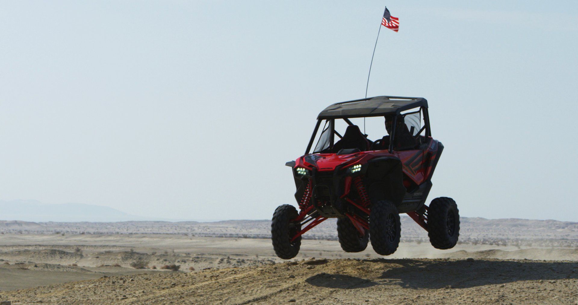 red utv driving through Borrego Springs mountains