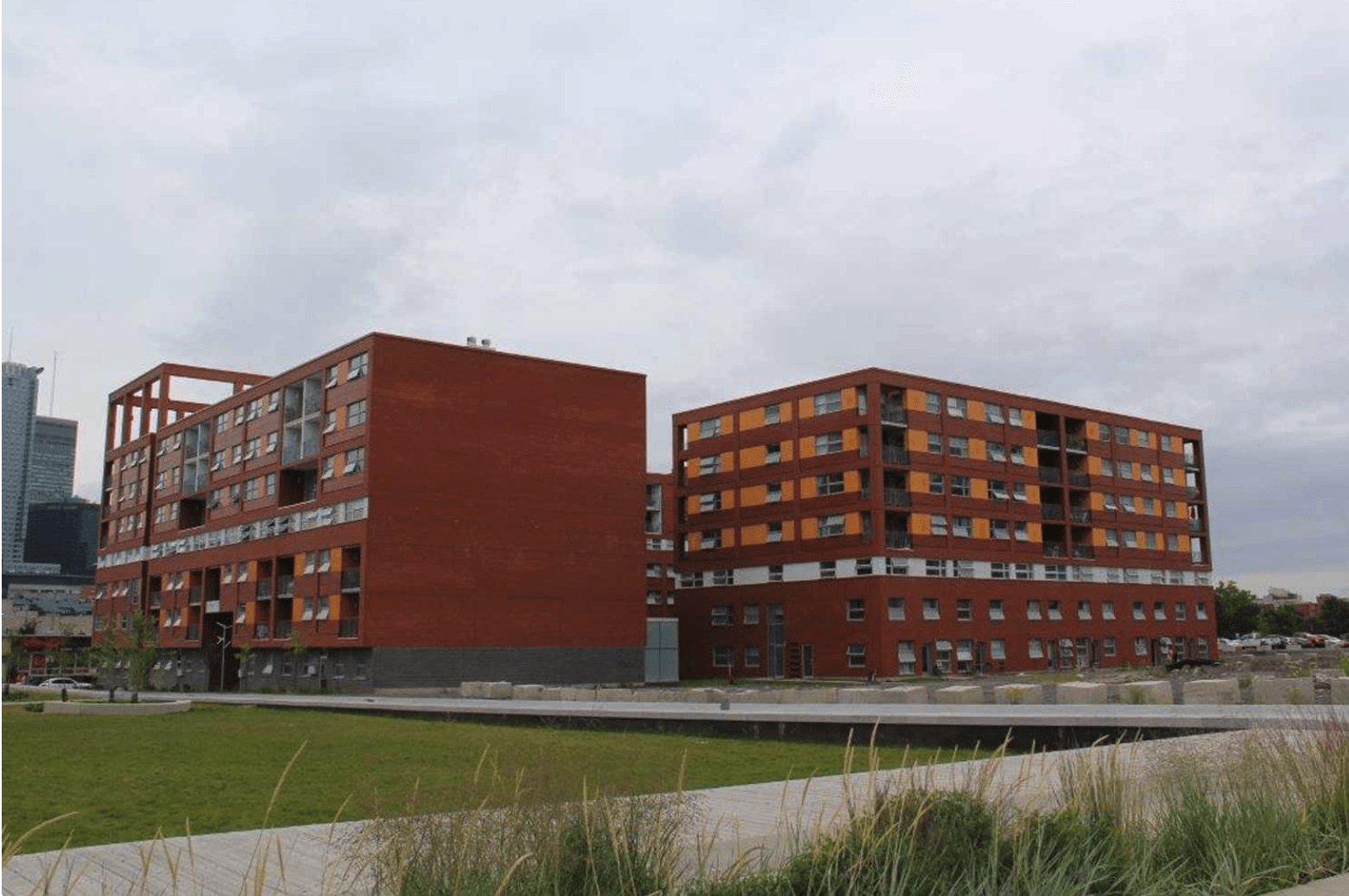 A large red brick building with a lot of windows
