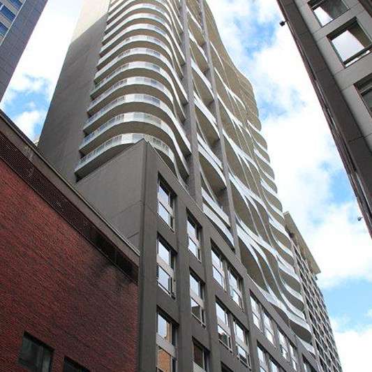 Looking up at a tall building with a lot of windows