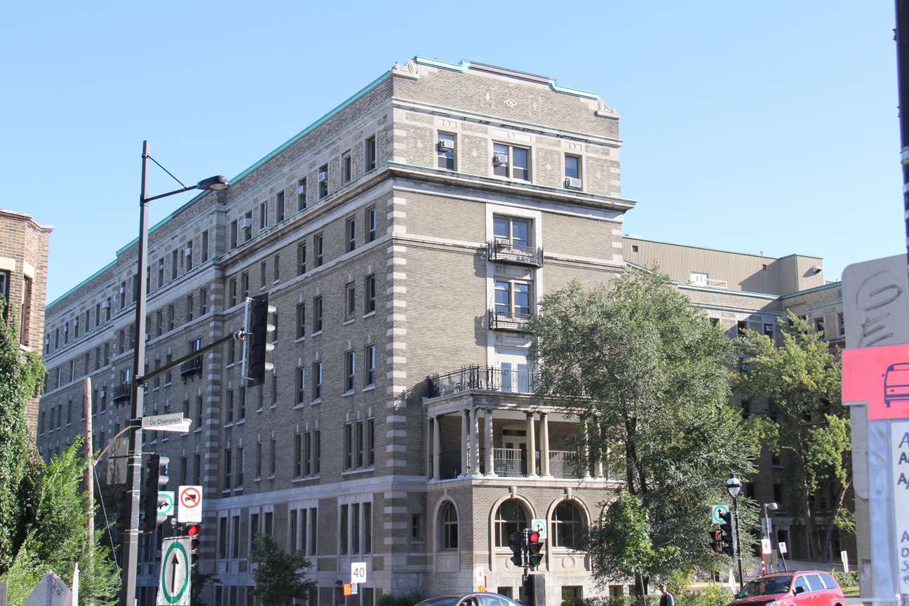 A large building with a sign that says no parking