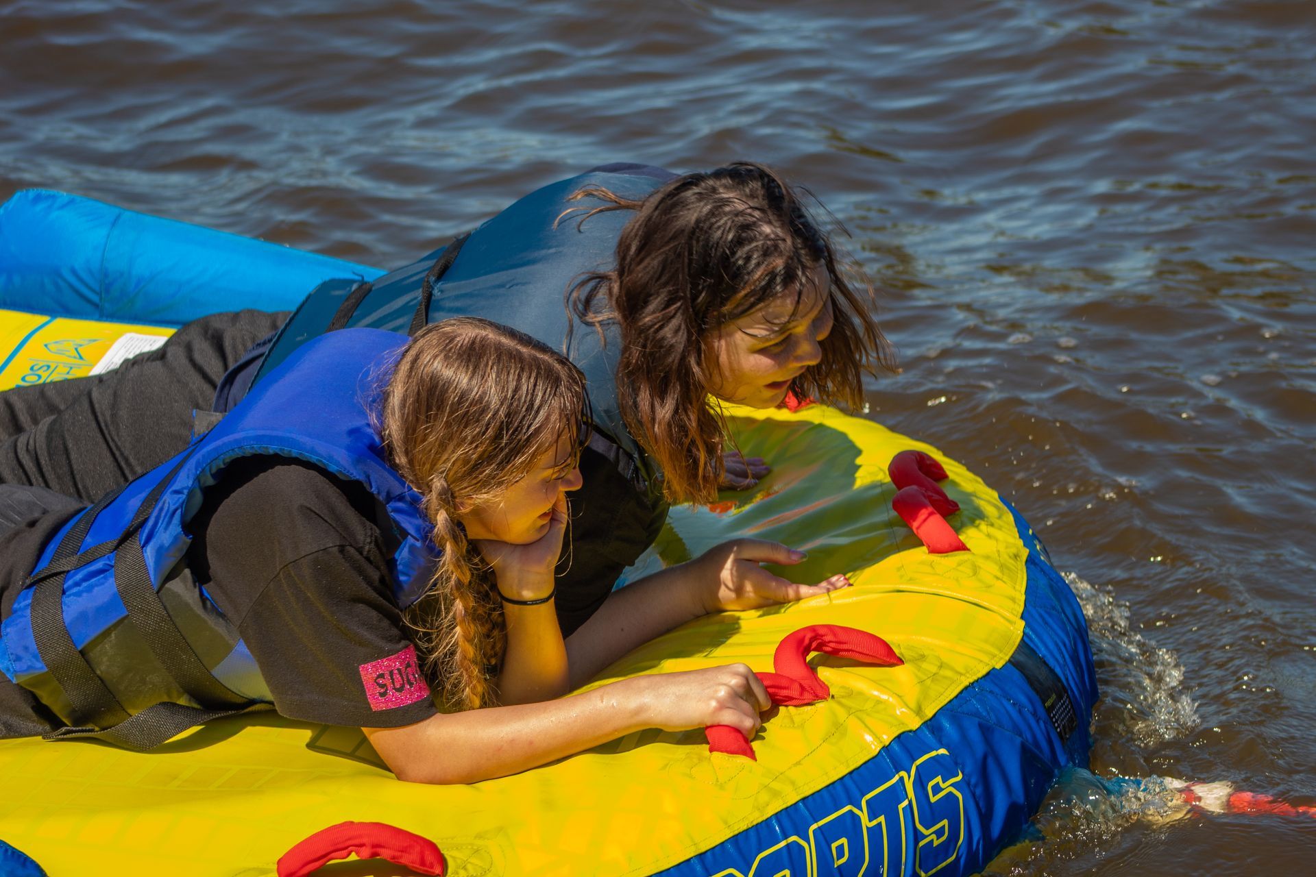 Two Young Girls Laying On A Raft – Virginia Beach, VA – Tabernacle Baptist Church