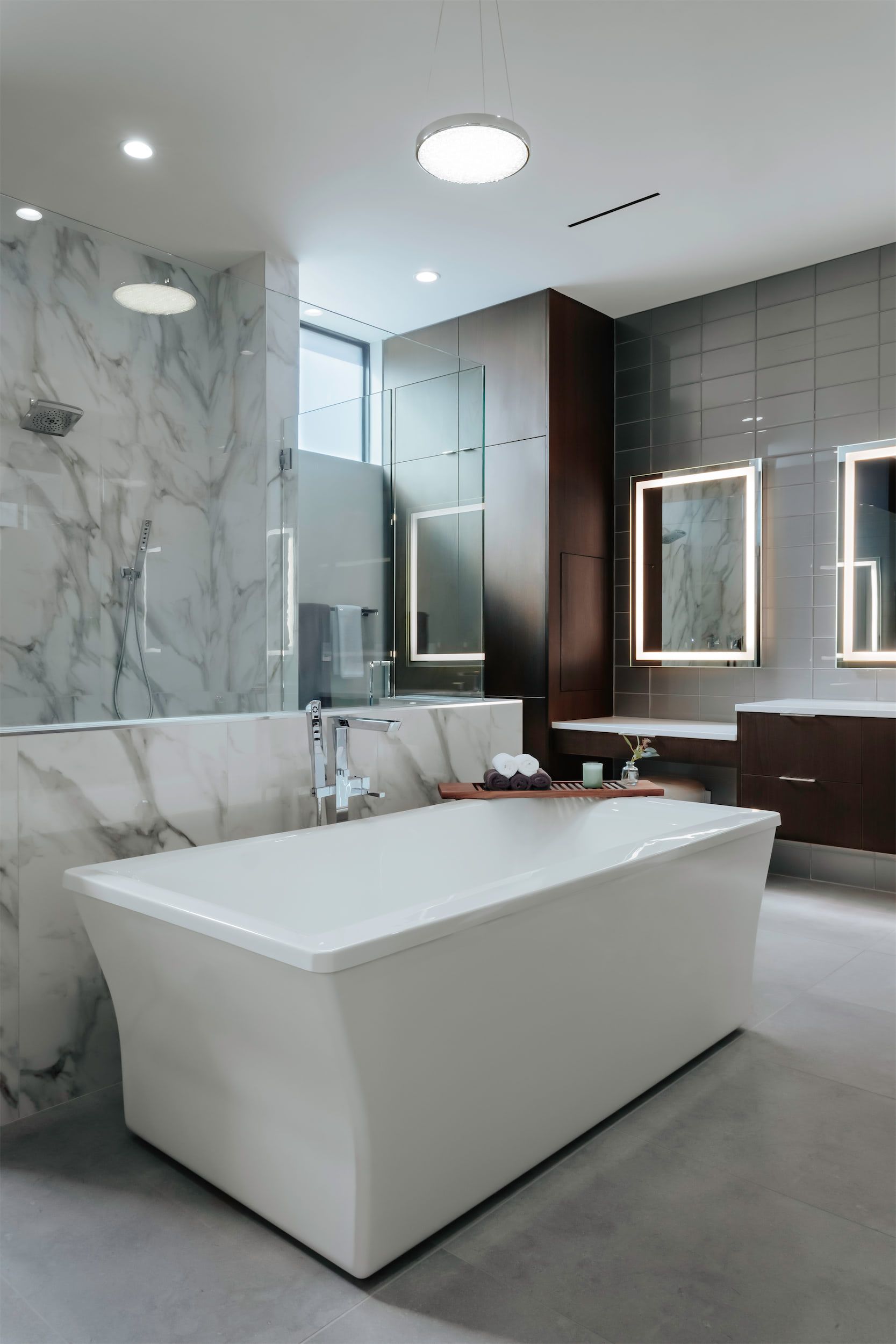 There is a large bathtub in the middle of the bathroom.