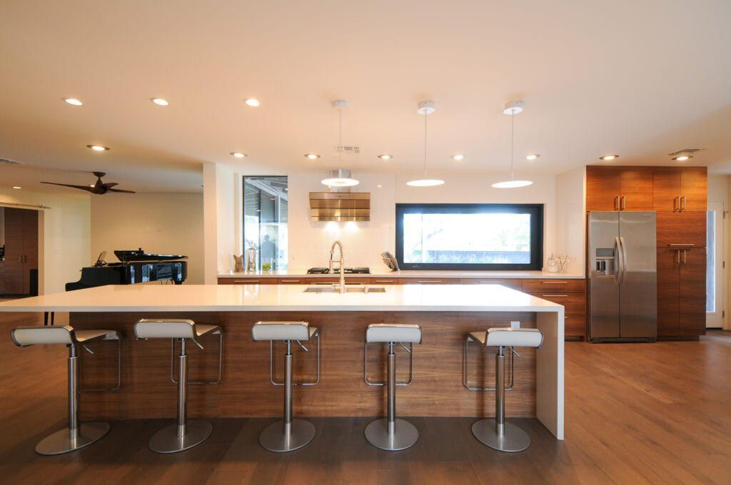 A kitchen with a large island and stools in a Phoenix, arizona house