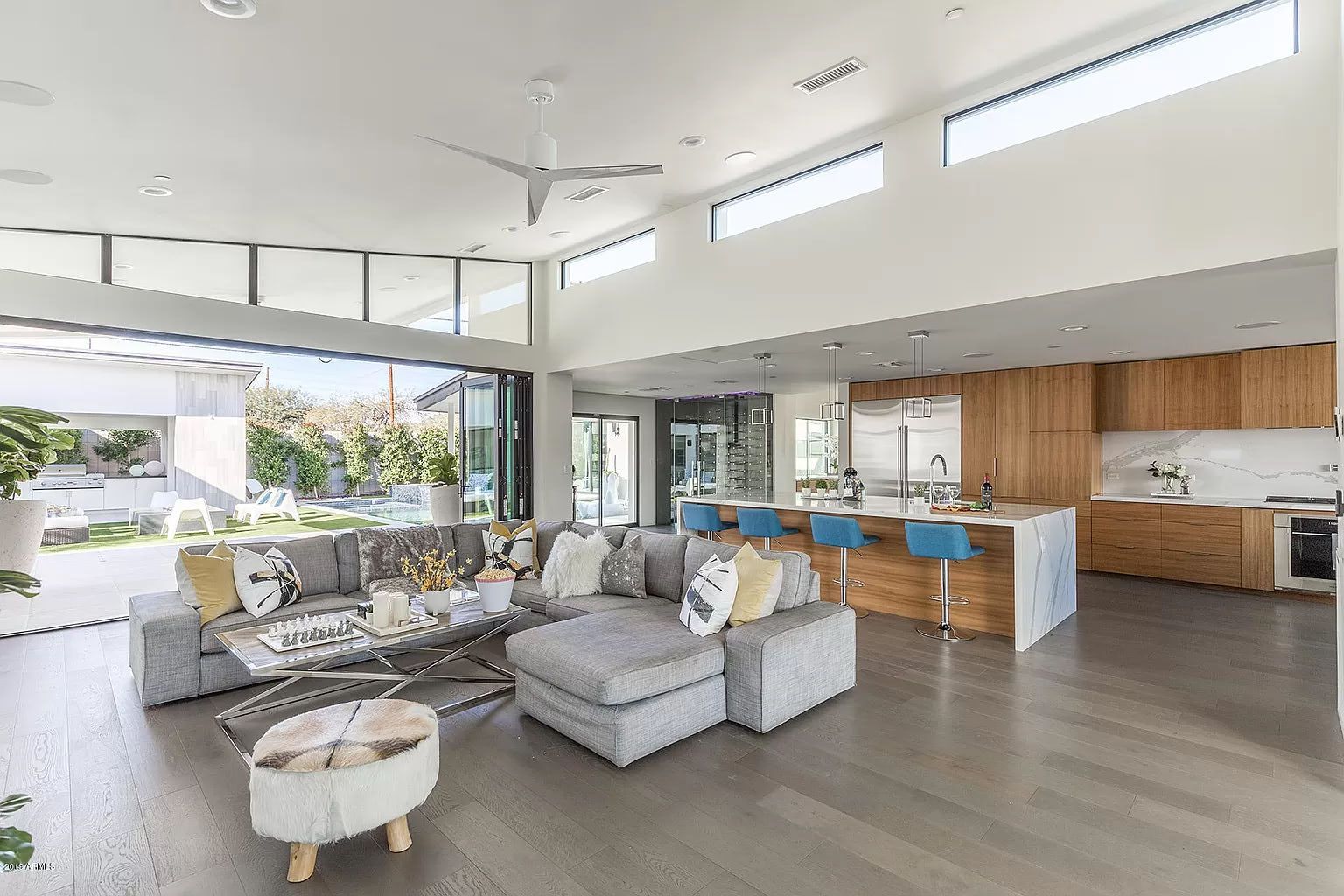 A living room with a couch and a table in a house.