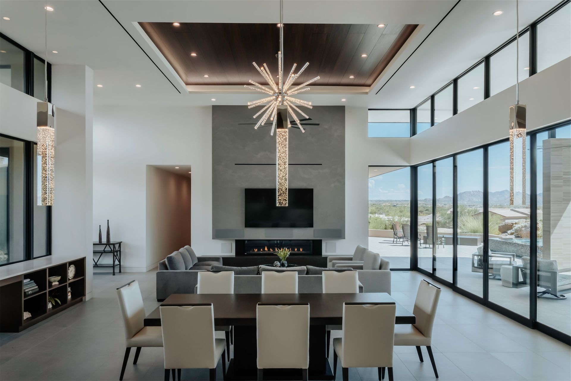 There is a dining table and chairs in the middle of the room.