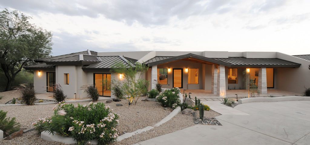 A large swimming pool with a view of the Arizona desert.