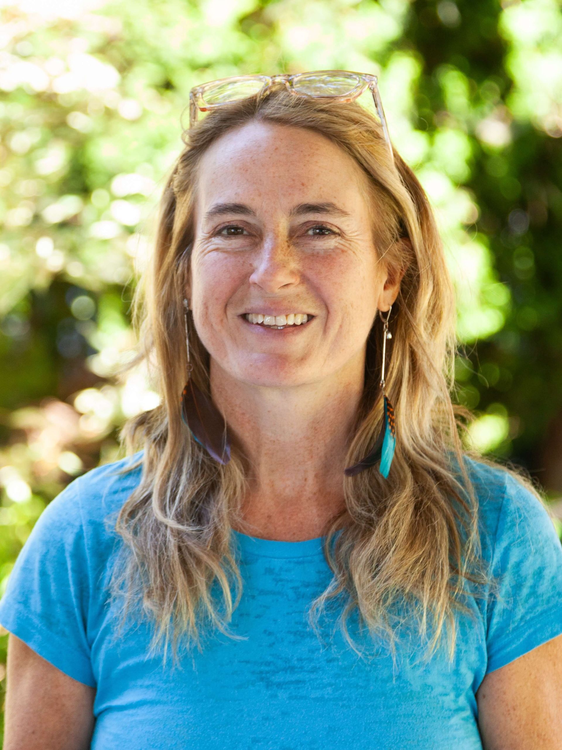 Woman smiling with blonde hair.