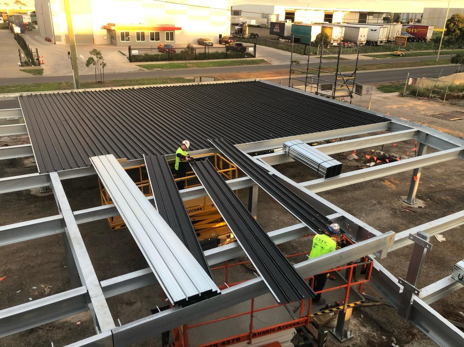 A roof is being built on top of a metal structure.