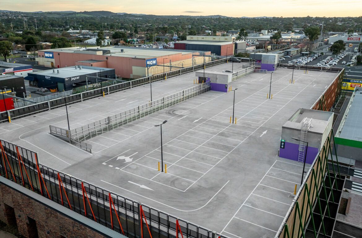 An aerial view of an empty parking lot in a city.