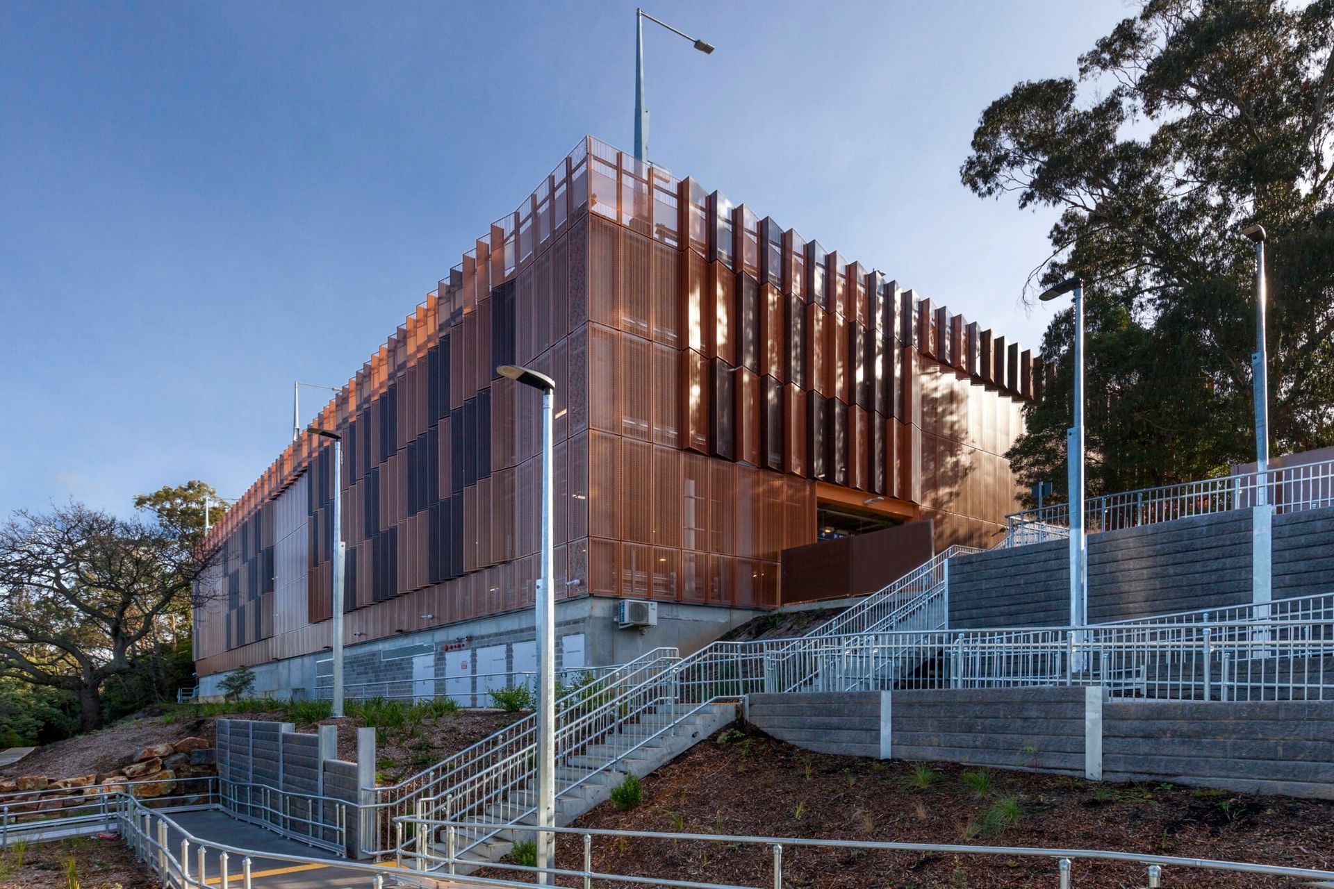 A large building with a wooden facade and stairs leading up to it.