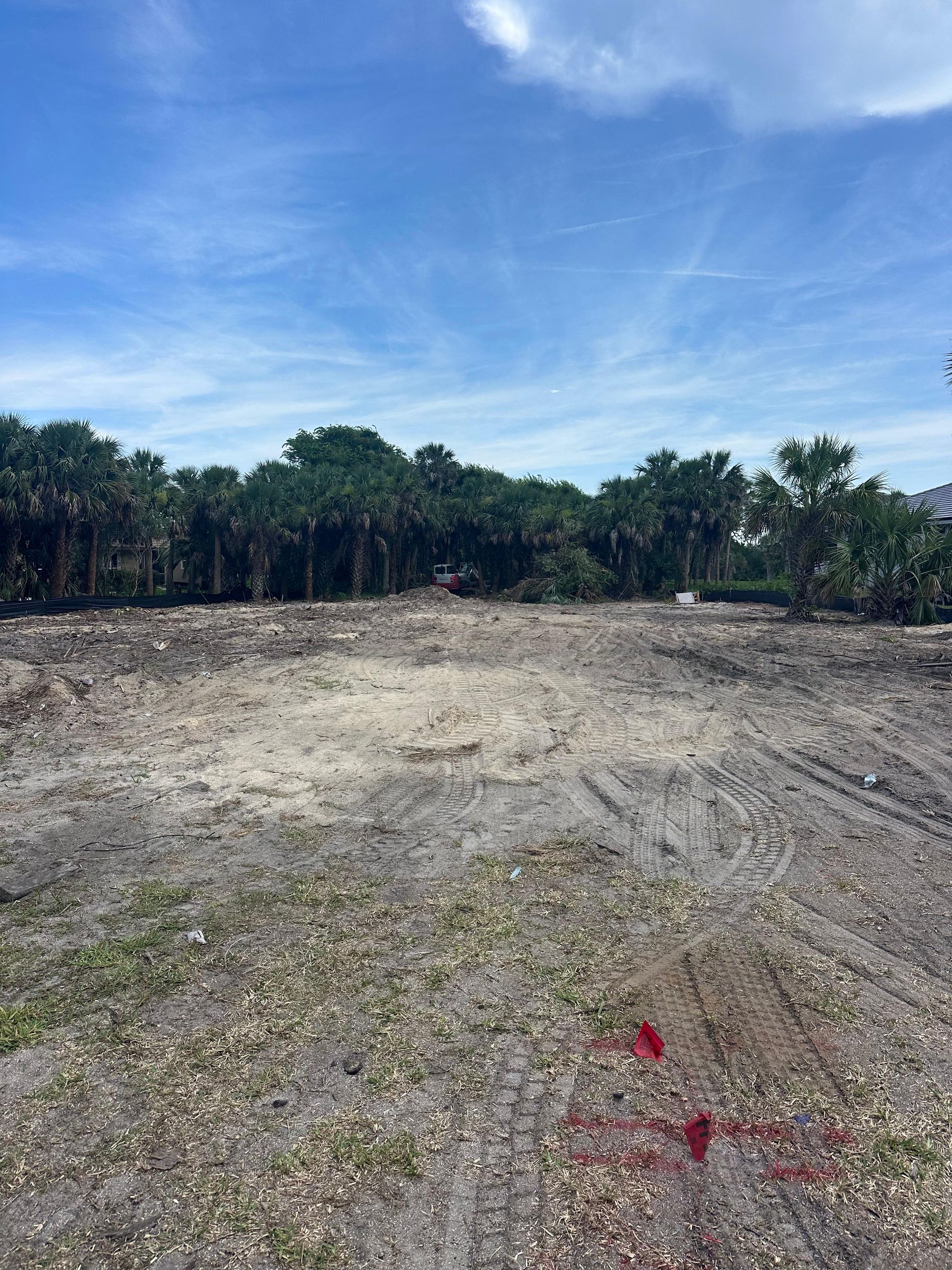Stone wall with irregularly shaped rocks held together by wire mesh.