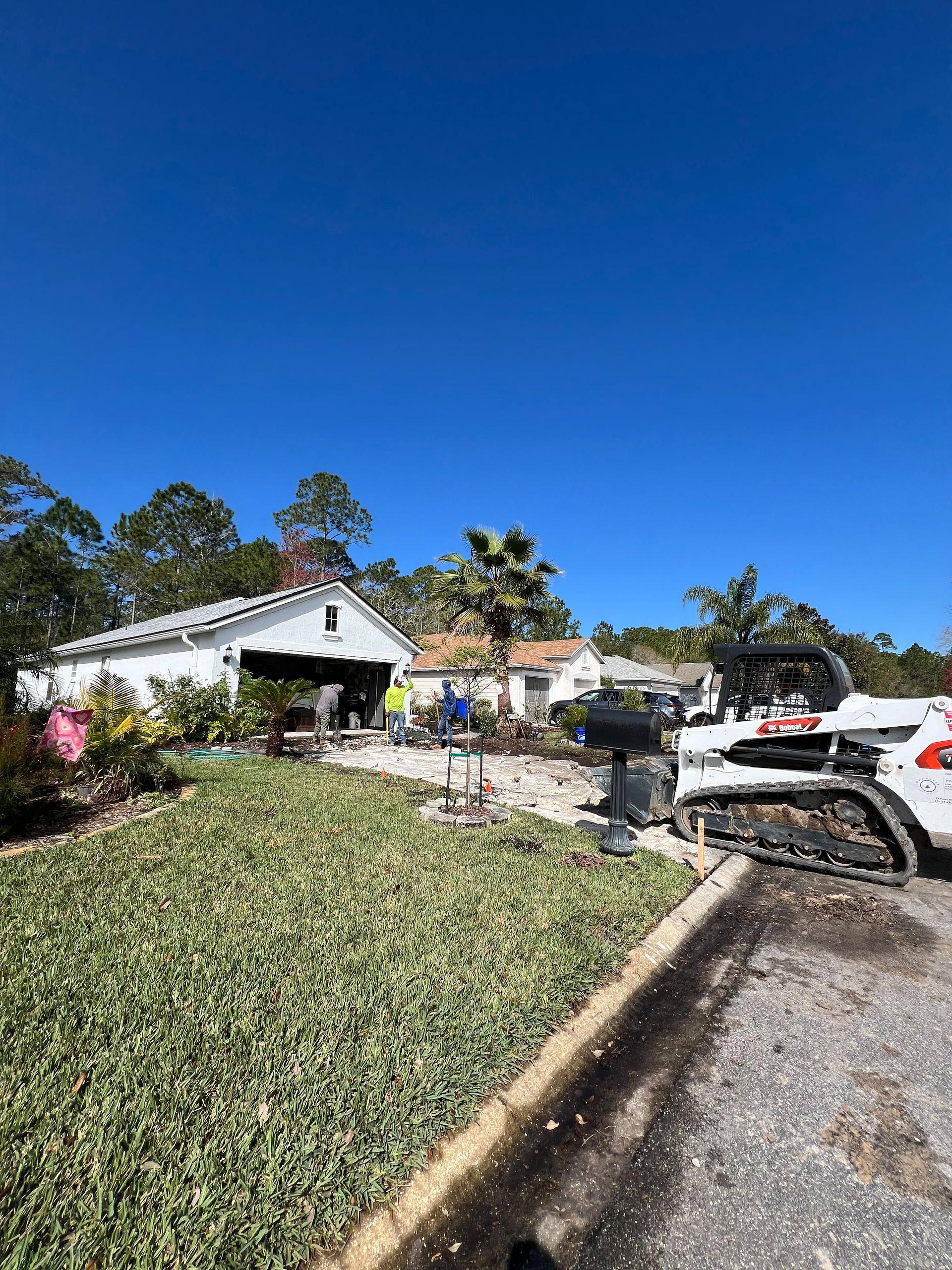 Stone wall with wire mesh, gray and beige stones, detailed pattern.