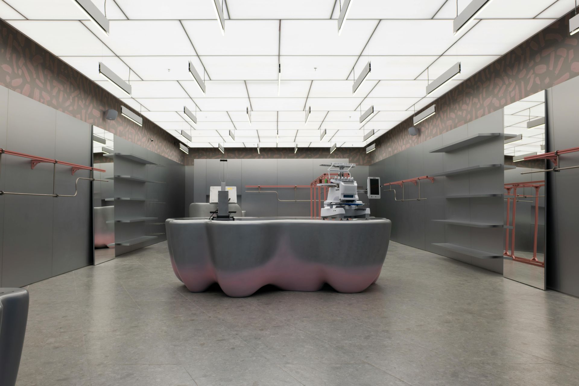 Polished concrete commercial flooring installation in modern business space with sleek gray walls