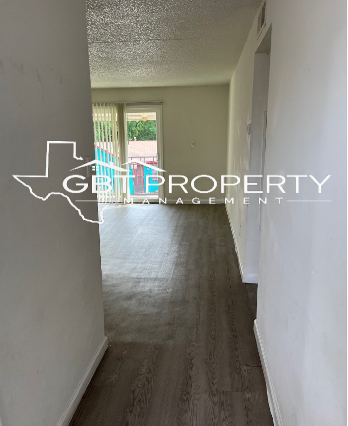 A hallway with a sign that says get property on it
