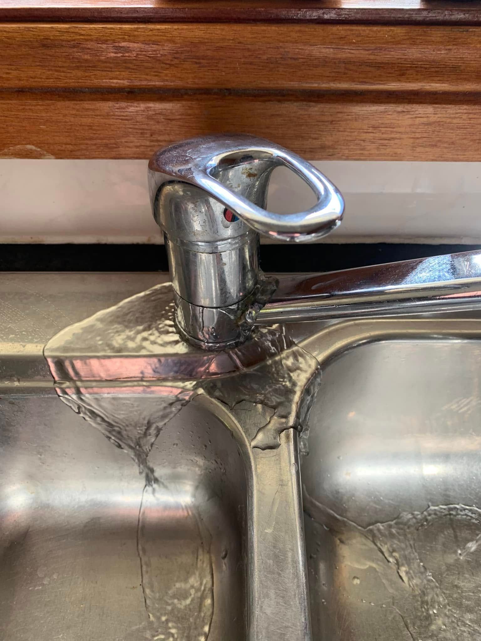 A Close Up of a Faucet in a Kitchen Sink— Delaney Plumbing Services In Taree, NSW