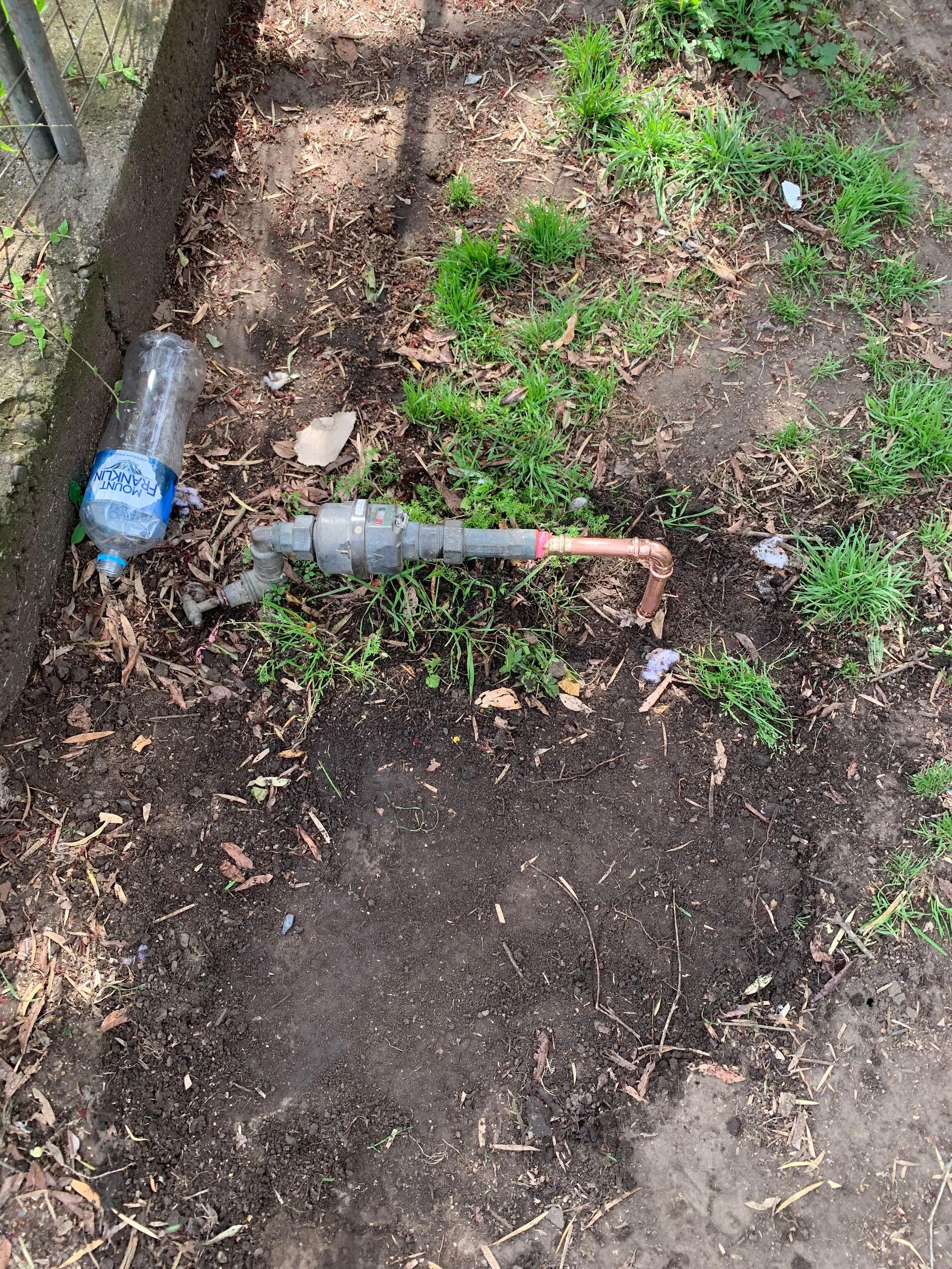 Faucet on the Ground — Delaney Plumbing Services In Taree, NSW