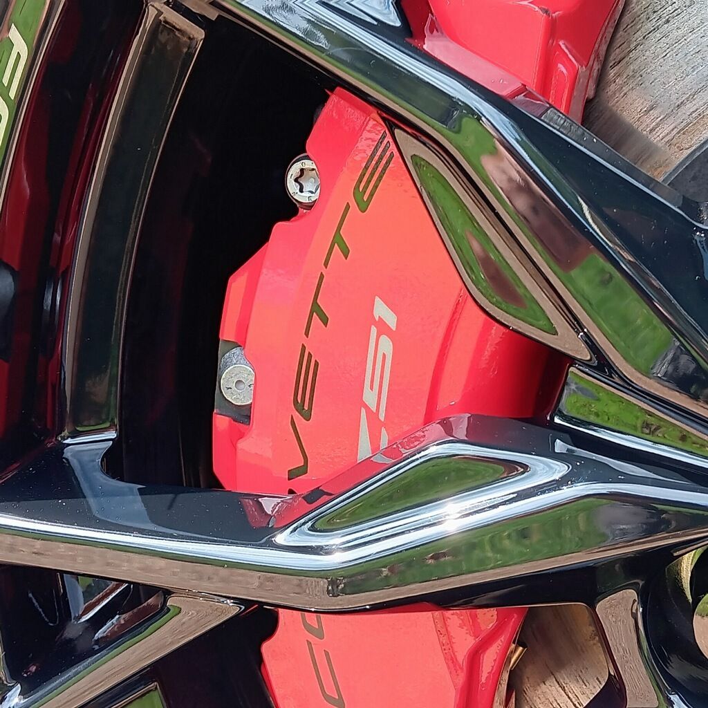 A red brake caliper with the word vette on it