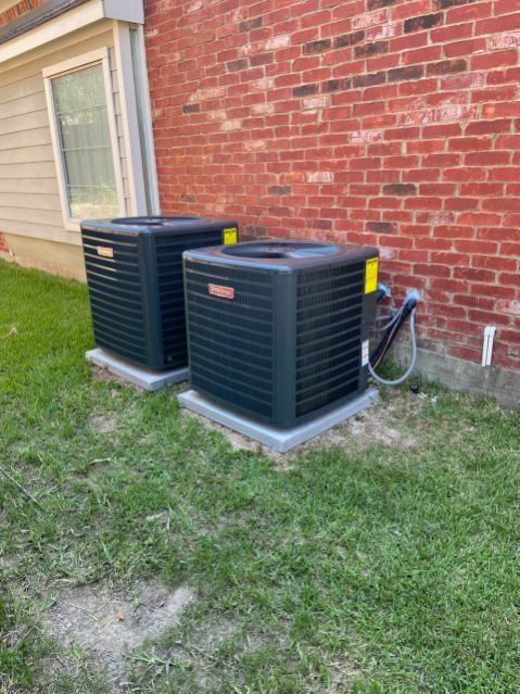 An air conditioner is being installed in the attic of a house.
