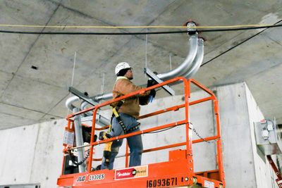Electrician works on a lift