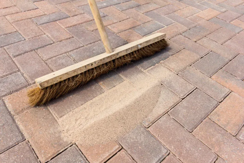 A construction worker is working on a concrete wall.