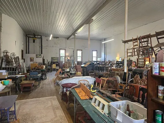 A large room filled with furniture and shelves.