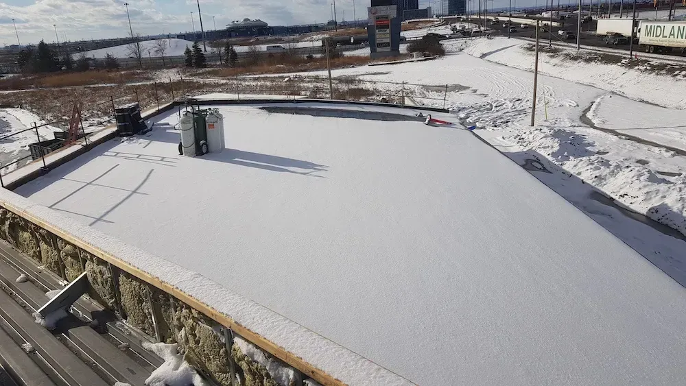 The roof of a building is covered in snow.
