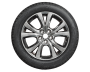 A close up of a car wheel on a white background.