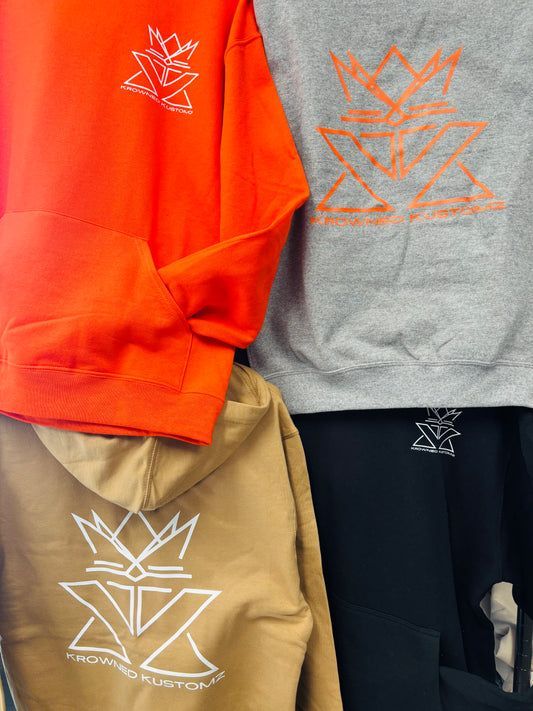 A group of hoodies are stacked on top of each other