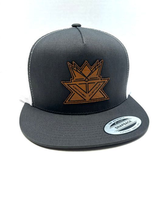 A black hat with a brown crown on it is on a white background.