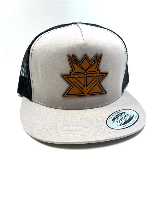 A baseball cap with a crown on it is on a white background.