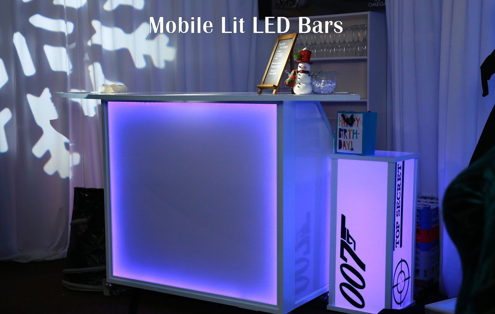 A mobile lit led bar with a 007 logo on it