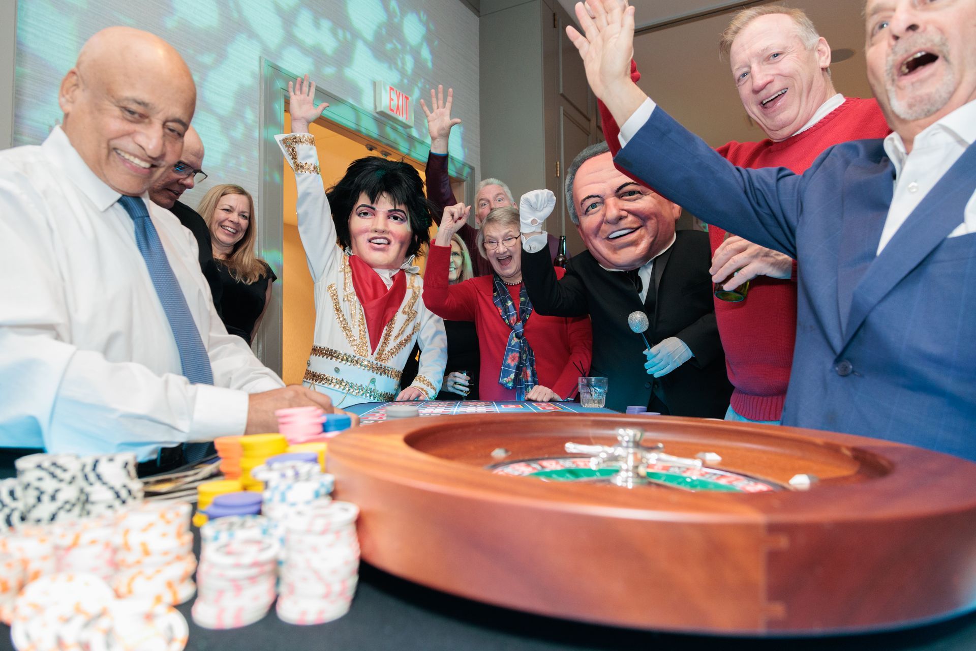 A group of people are playing roulette in a casino.