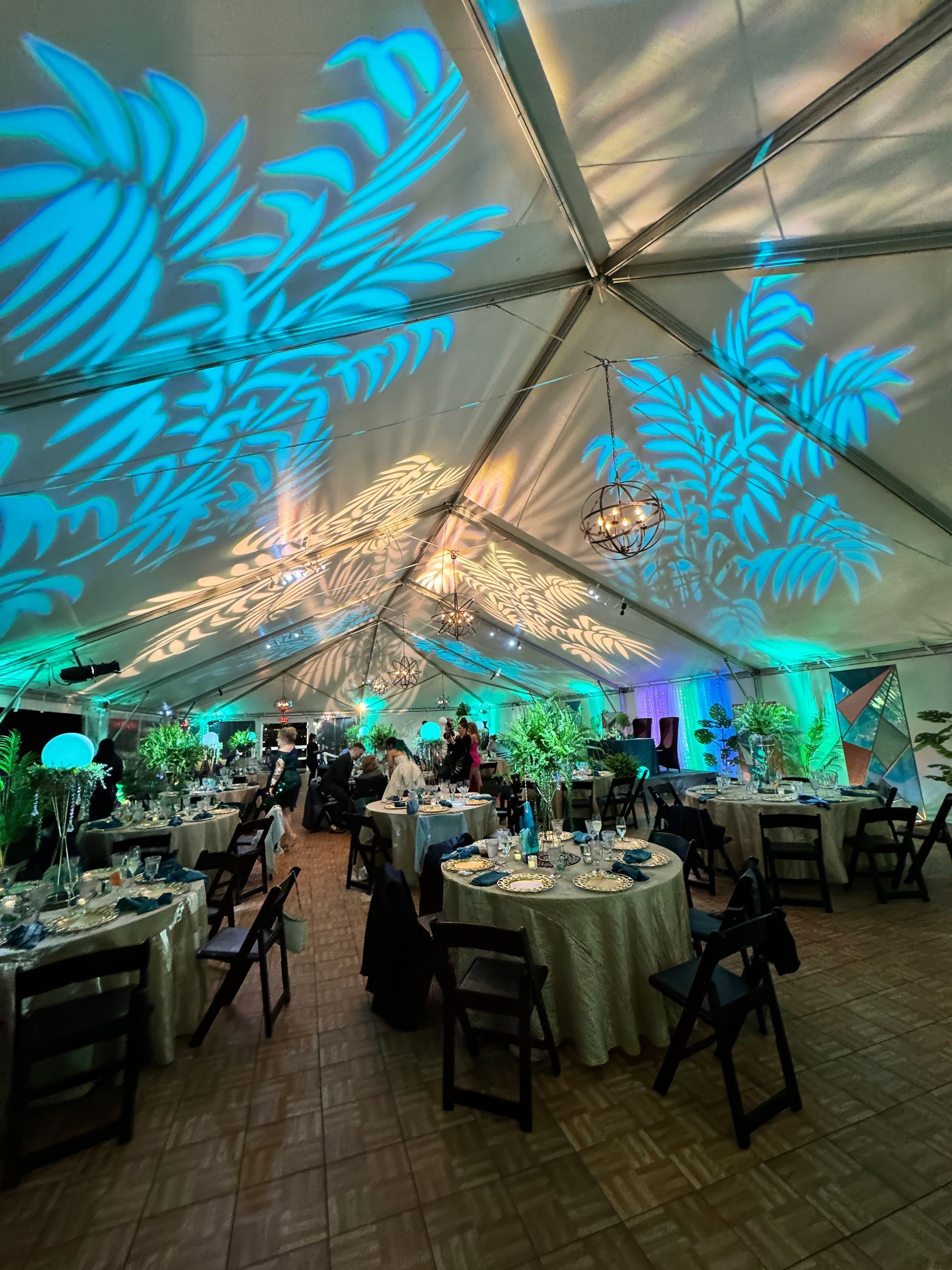 A bride and groom are dancing at their wedding reception