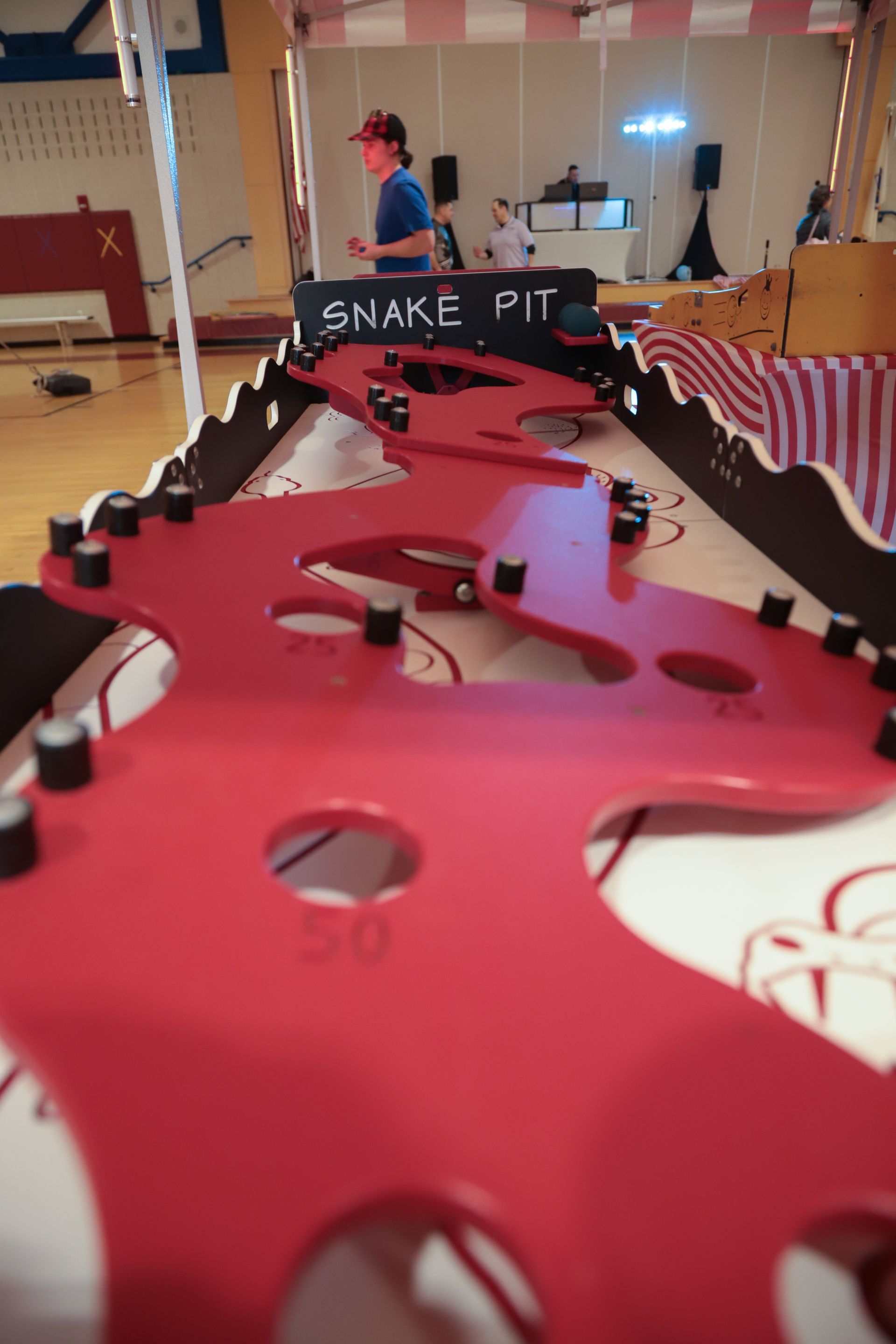 A snake pit game is being played in a gym