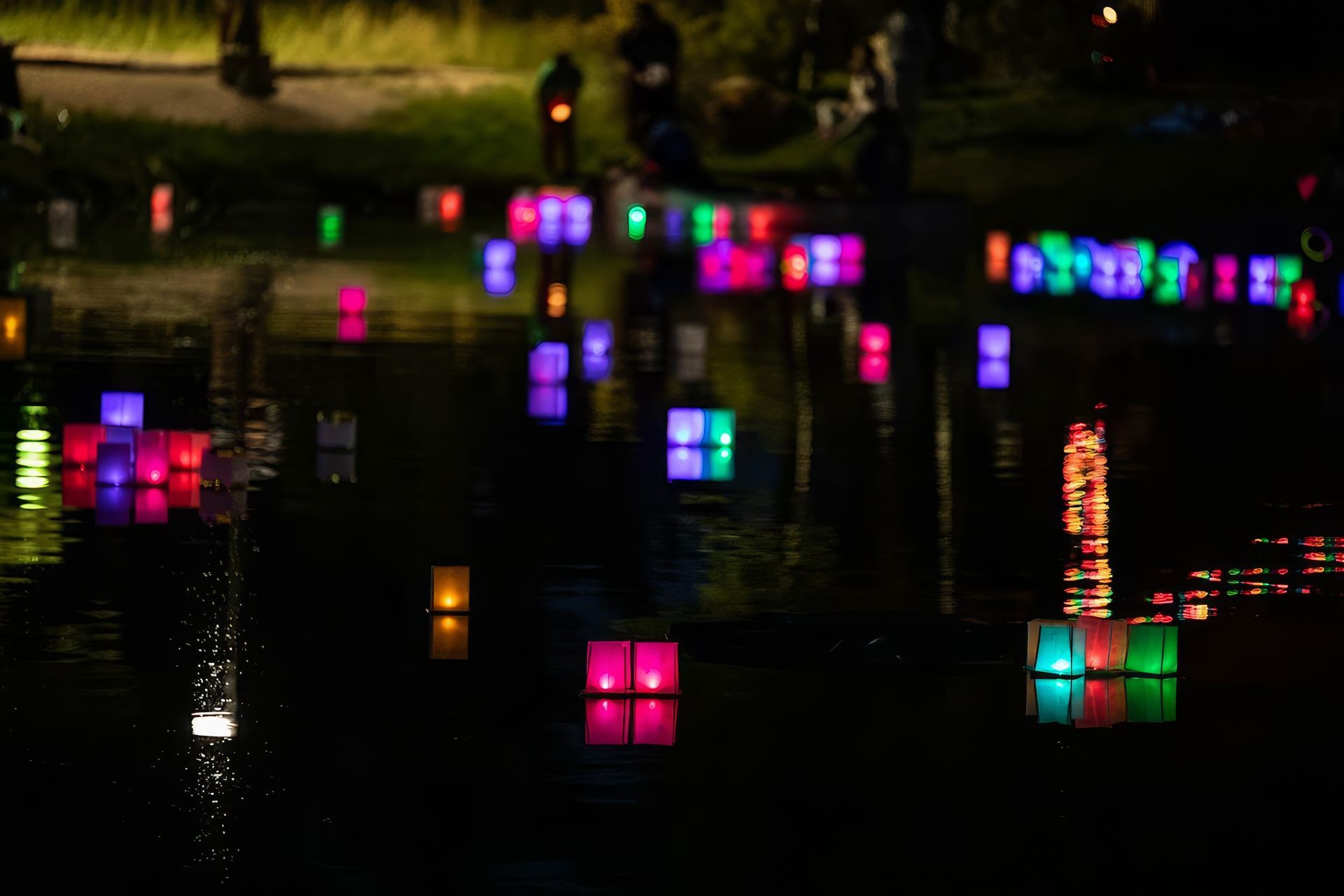 A bride and groom are dancing on a dance floor in front of a crowd.