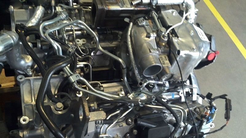 A close up of a car engine in a garage | Autotrends