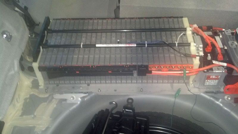 A car battery is sitting in the trunk of a car | Autotrends