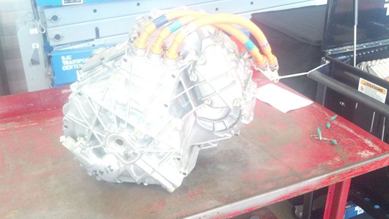 A motor is sitting on top of a red table | Autotrends