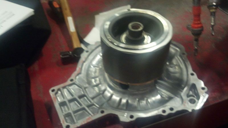 A metal object with a hole in the middle is sitting on a table | Autotrends