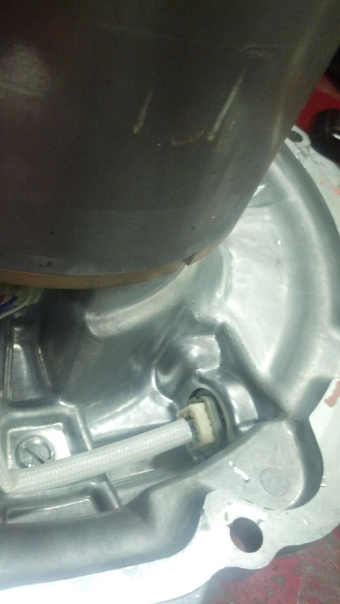 A close up of a metal object with a hose attached to it | Autotrends