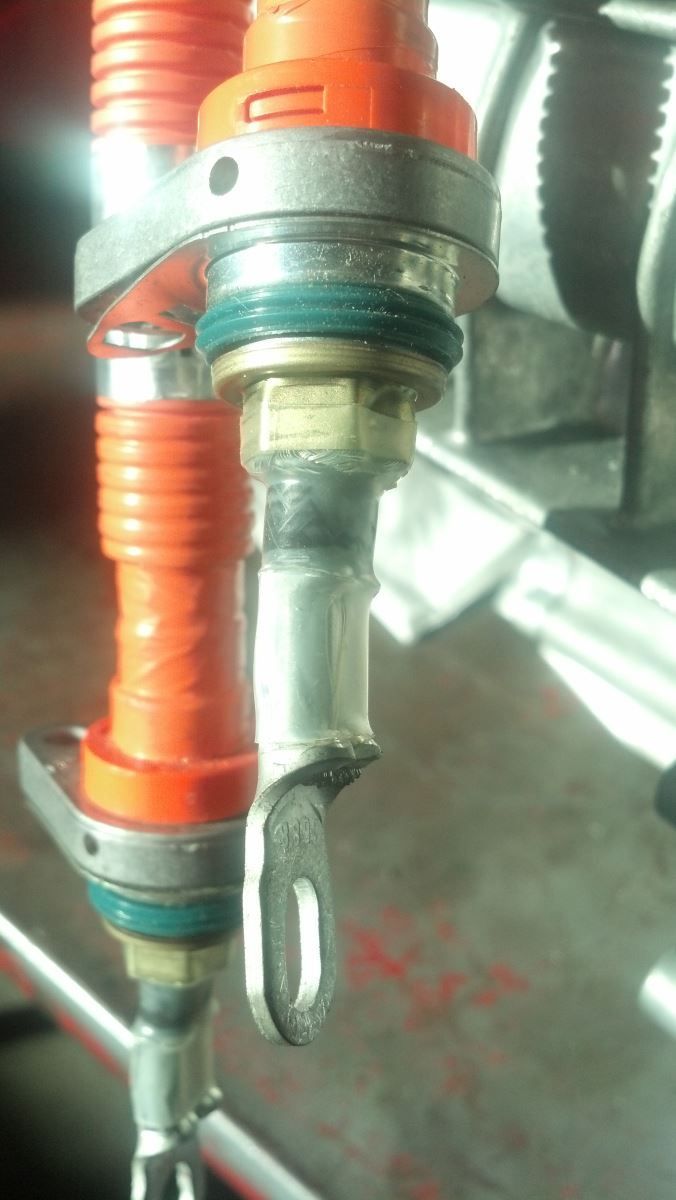A close up of a metal object with a hose attached to it | Autotrends